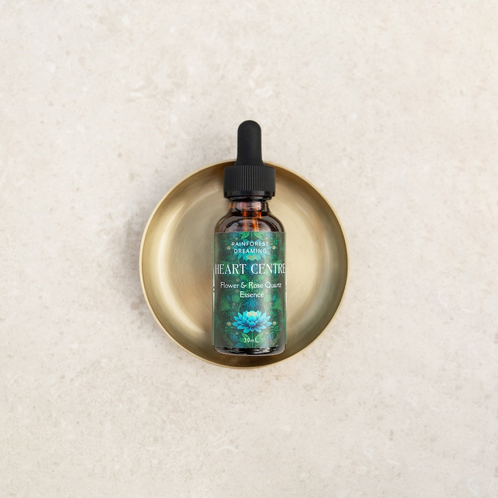 Heart Centre Flower & Rose Quartz Essence 30ml in a gold dish, promoting love and wellness with premium quality ingredients.