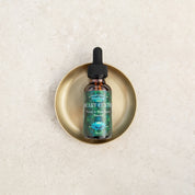 Heart Centre Flower & Rose Quartz Essence 30ml in a gold dish, promoting love and wellness with premium quality ingredients.