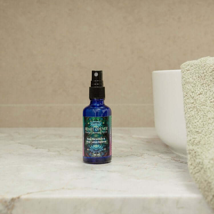 Heart-Opening Cleansing Mist bottle on a marble countertop, featuring premium quality organic ingredients for self-discovery.