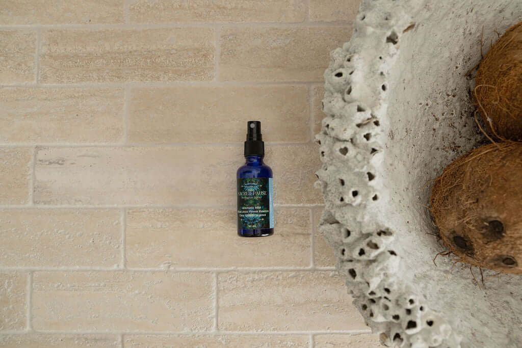 Blue Lotus Meditation Mist by Rainforest Dreaming on a neutral surface, emphasizing premium quality for cacao rituals.
