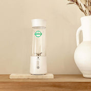 Soma Portable Blender on a wooden shelf, designed for making premium quality ceremonial cacao anywhere.