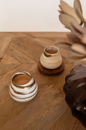 Handcrafted wheel-thrown mini cups for ceremonial cacao, showcasing premium quality and unique artistry by VillageLore Pottery.
