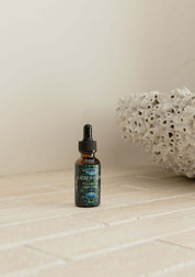 Blue Lotus Flower Essence in an amber dropper bottle, showcasing premium quality for relaxation and well-being.